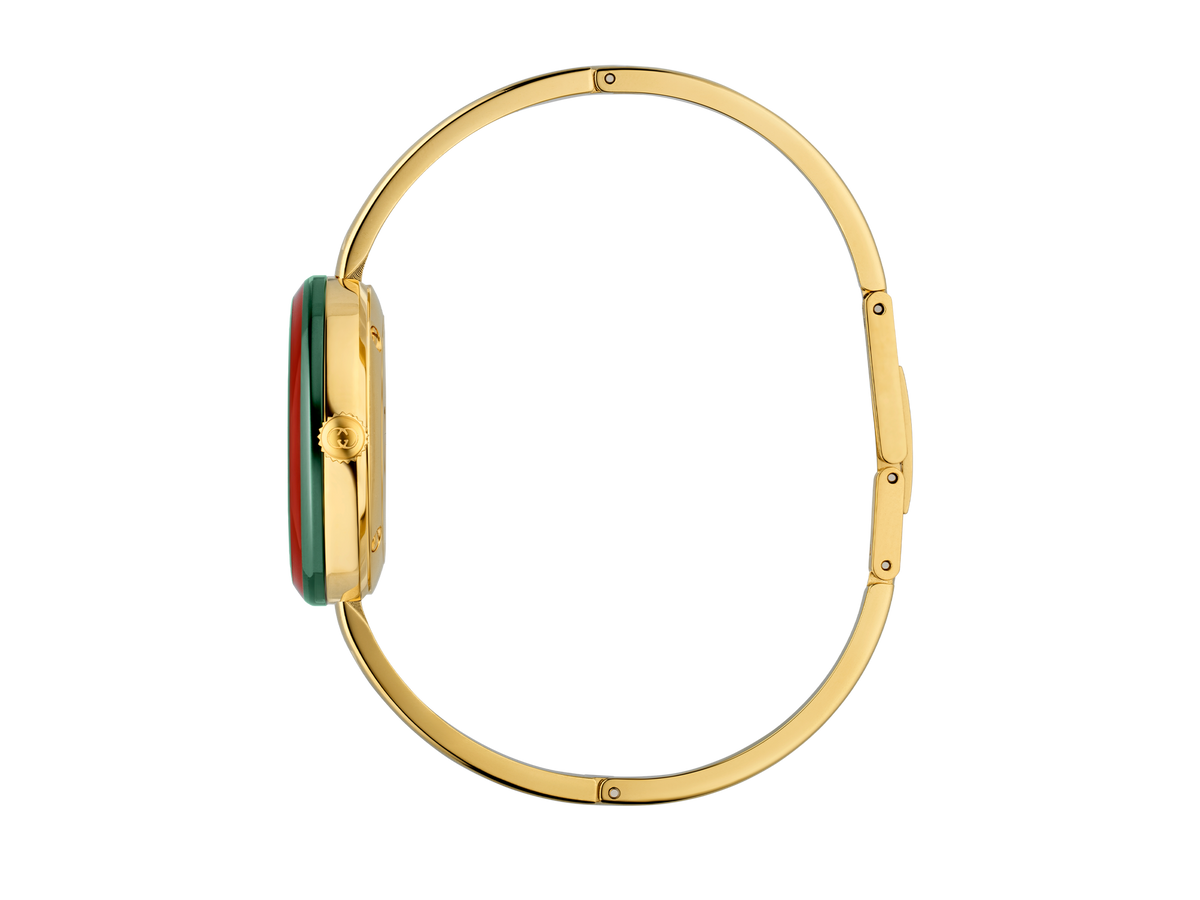 Die Schullin GUCCI PLAY Armbanduhr hat ein schlankes goldenes Profil, ein goldenes Band, eine kleine runde Krone und dezente grüne und rote Akzente am Rand des Zifferblatts.