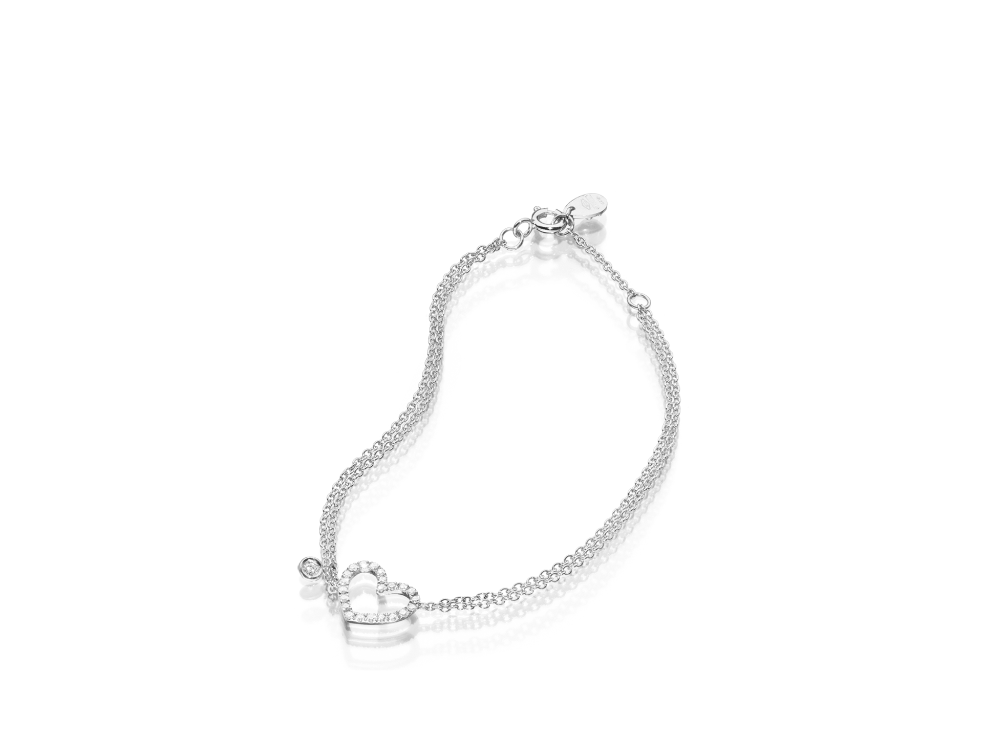 Armband mit Diamant-Herz und einem losen Diamanten in 18 Karat Weißgold.