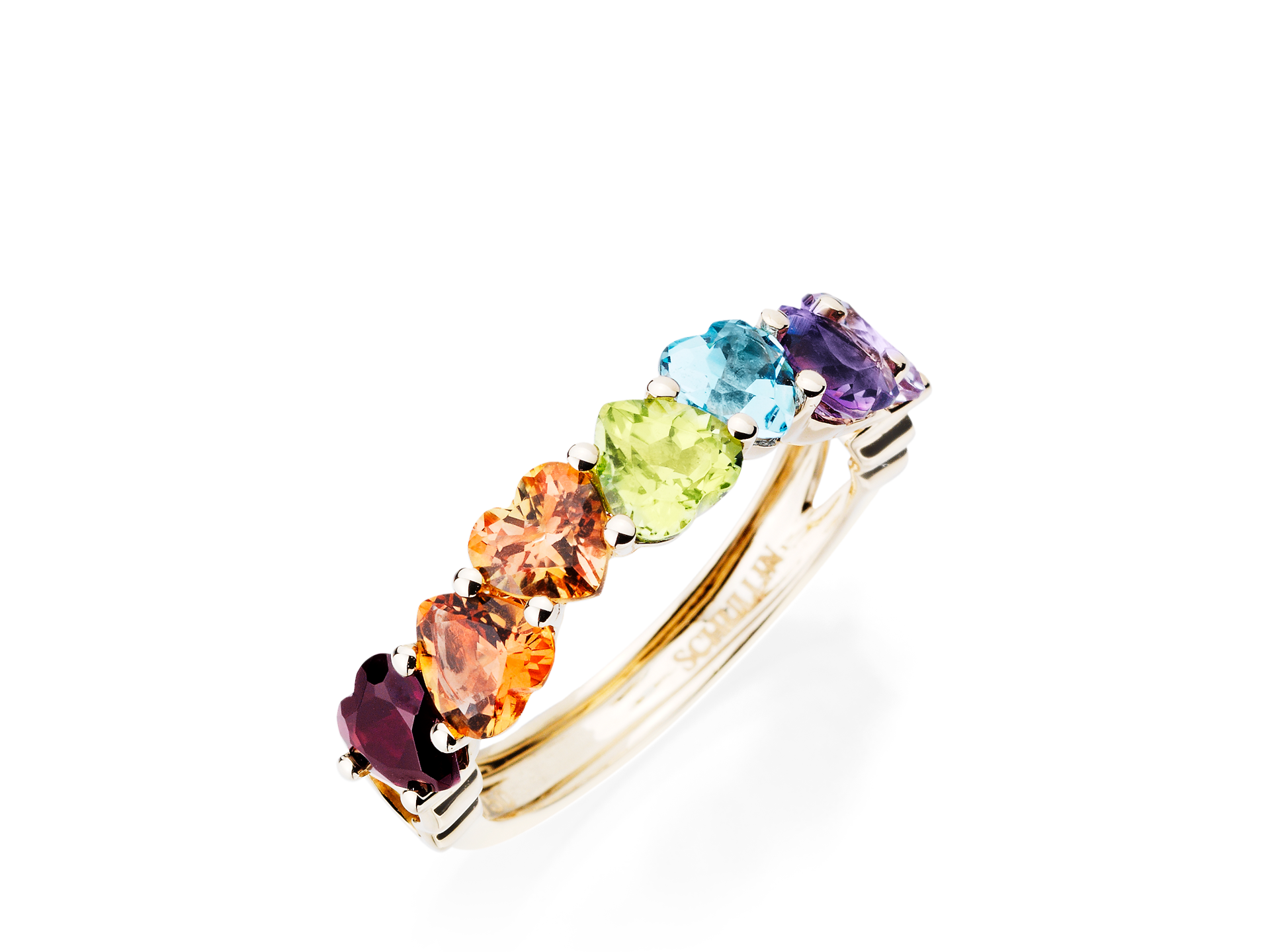 Der Schullin HERZ RING MEMORY ist ein Goldring mit sechs farbigen Edelsteinen - lila, rot, orange, gelb, hellblau und grün -, die in einer Reihe vor einem weißen Hintergrund angeordnet sind.