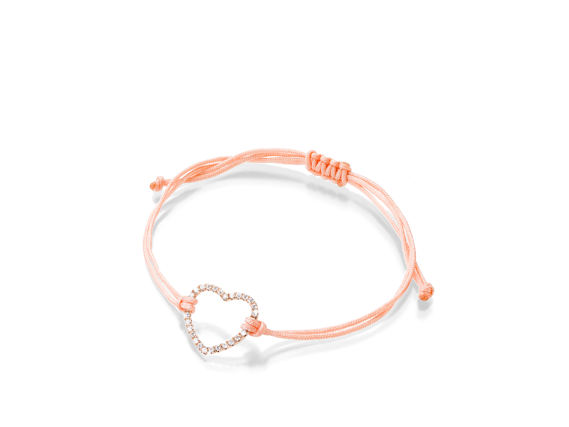 Das HERZ ARMBAND von Schullin besteht aus einem herzförmigen Anhänger aus Roségold mit kleinen, funkelnden Edelsteinen an einem rosa Kordelarmband mit verstellbarem Knotendesign.