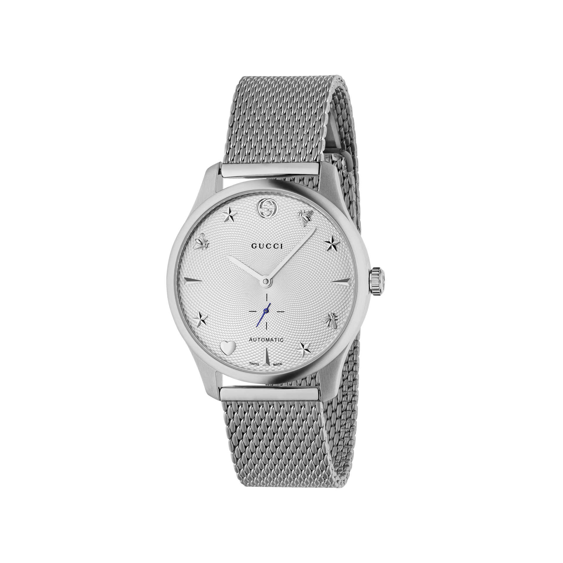 Eine silberne Schullin-Uhr aus der GUCCI G-TIMELESS-Kollektion verfügt über ein elegantes Milanaise-Armband und ein minimalistisches Zifferblatt mit Stern- und Bienenmotiv. Das Wort „Automatik“ sowie der Markenname sind auf dem Zifferblatt sichtbar, alles in einem raffinierten Edelstahlgehäuse untergebracht.